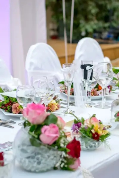 dining table with flowers and meal