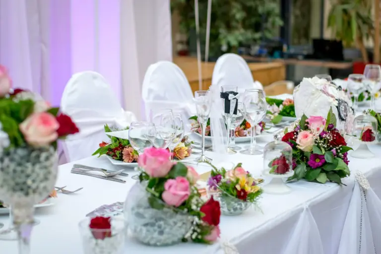 dining table with flowers and meal